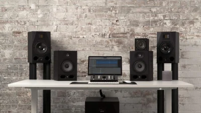 Mastering techno home studio setup with studio monitors, computer workstation and professional acoustic environment on desk